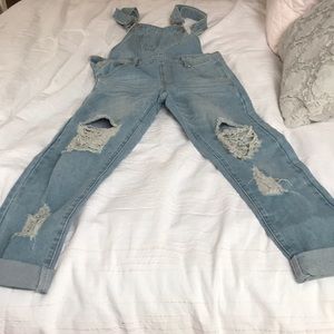 Light blue, ripped overalls from Sorelleuk.